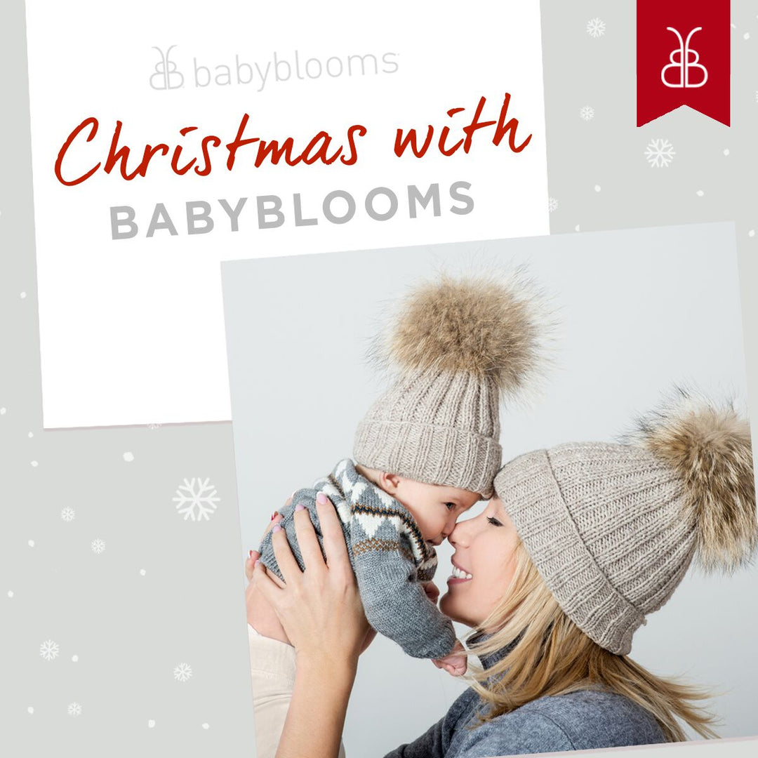 Mum kissing baby wearing woolly hat